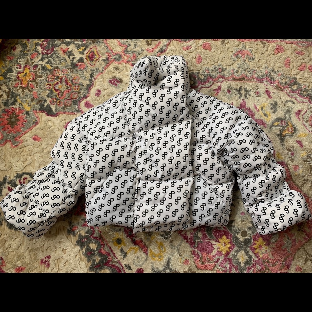 Saks Potts Logo Puffer in White with Black Font